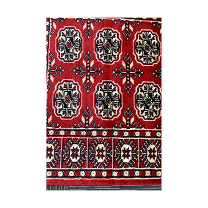 Gul medallion and border detail of Afghan Bokhara runner rug with red, black and ivory geometric pattern