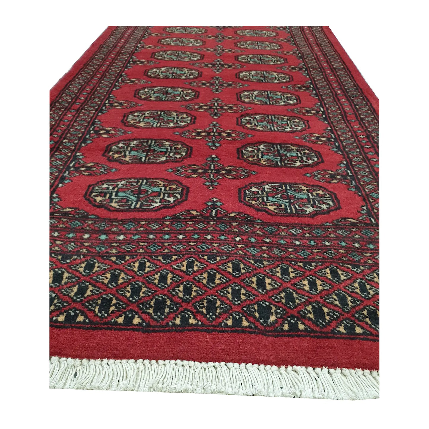 End field and fringe detail of Afghan Bokhara runner rug with red gul medallions and geometric end border