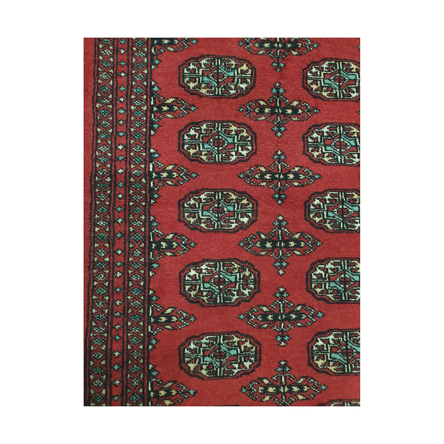 Pattern detail of Afghan Bokhara runner rug showing repeated gul medallions, red field and multicolour border