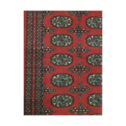 Pattern detail of Afghan Bokhara runner rug showing repeated gul medallions, red field and multicolour border