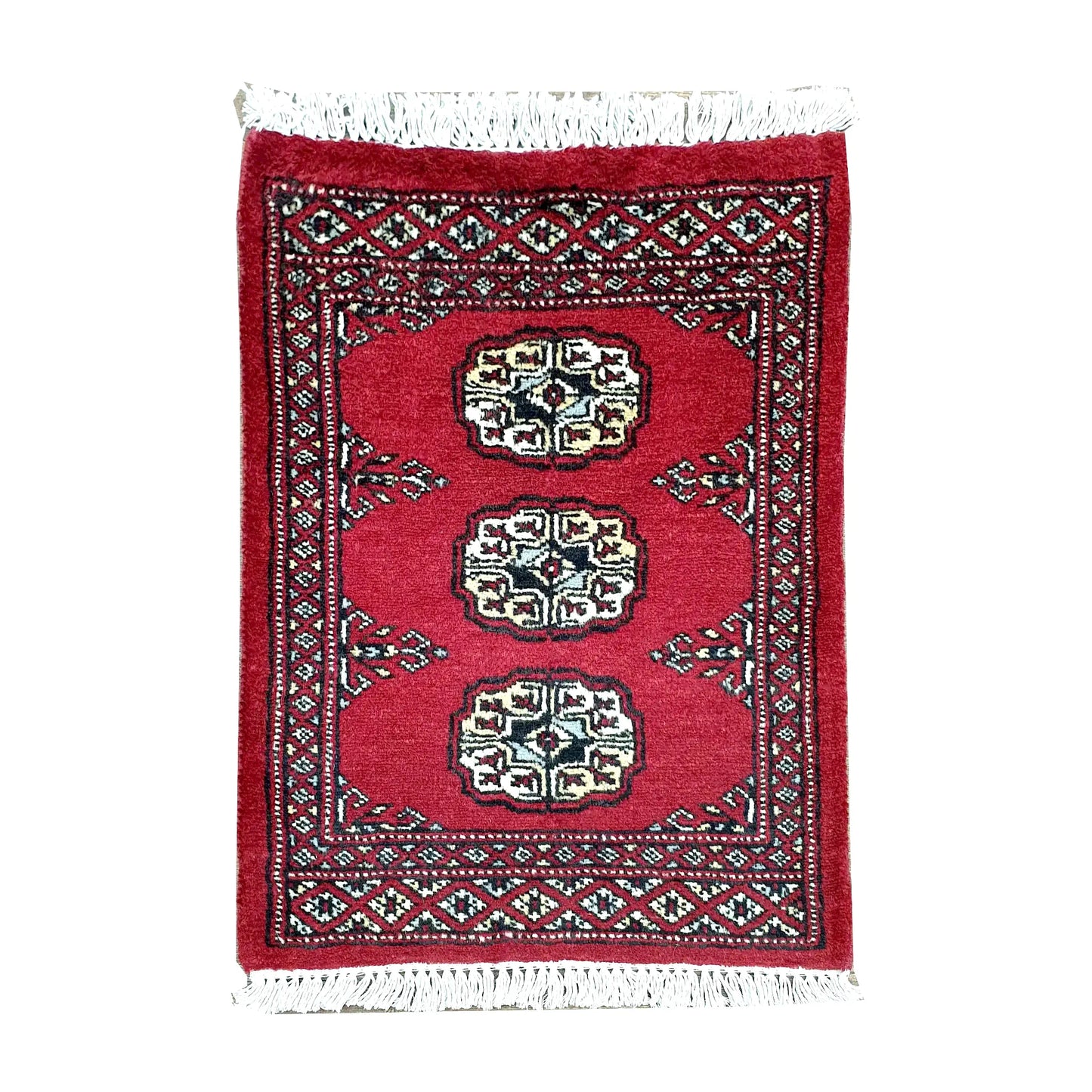 Afghan Bokhara wool rug 61 x 48 cm full view with red field, ivory gul medallions and fringe