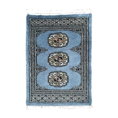 Afghan Bokhara wool rug 67 x 47 cm full view with blue-grey field, ivory gul medallions and fringe