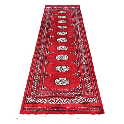 Full view of Afghan Bokhara runner rug with ten ivory guls in a row on a rich red field and layered geometric borders, 256 x 78 cm