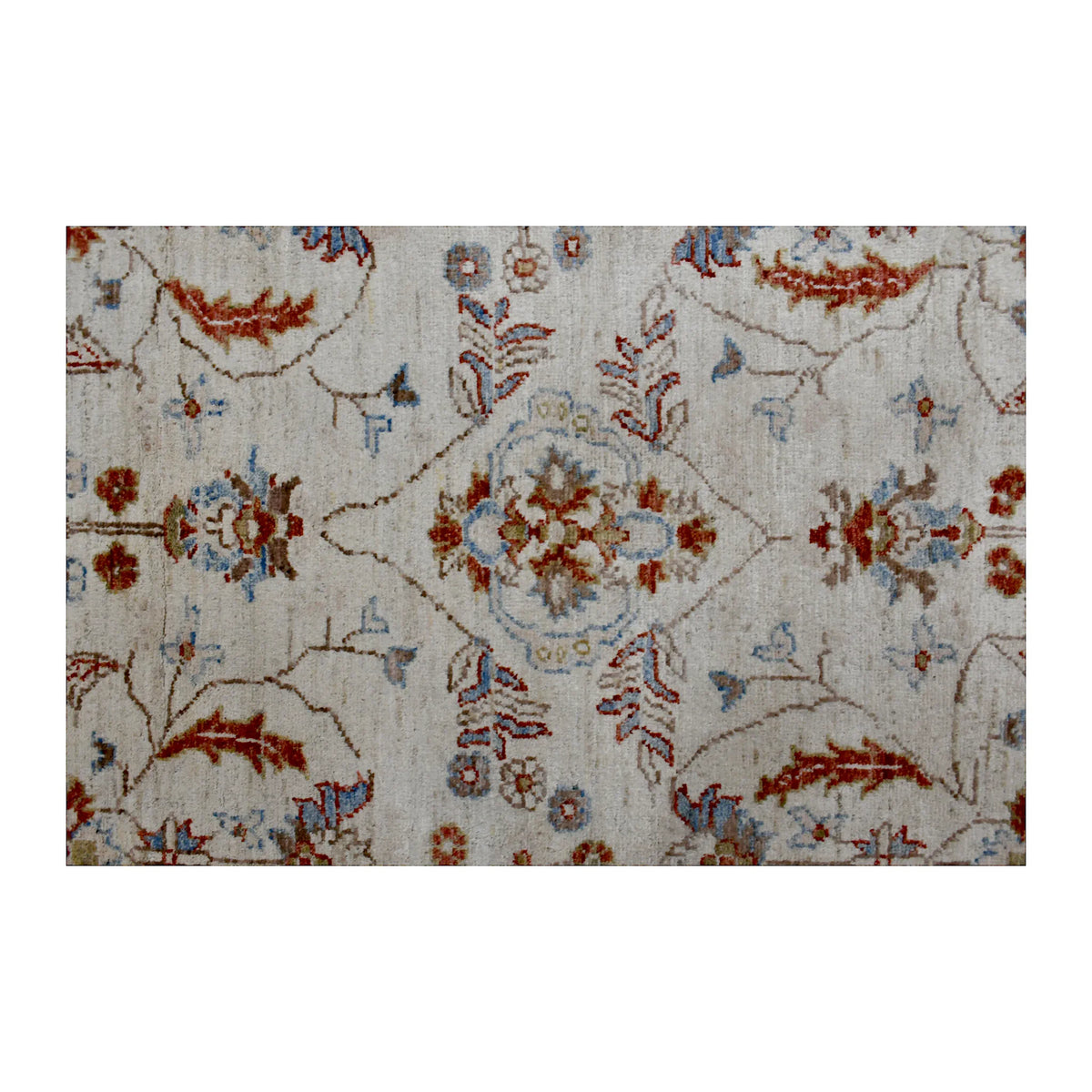 Close-up of beige Chobi rug showing the central floral motif, scrolling vines and pale blue accents
