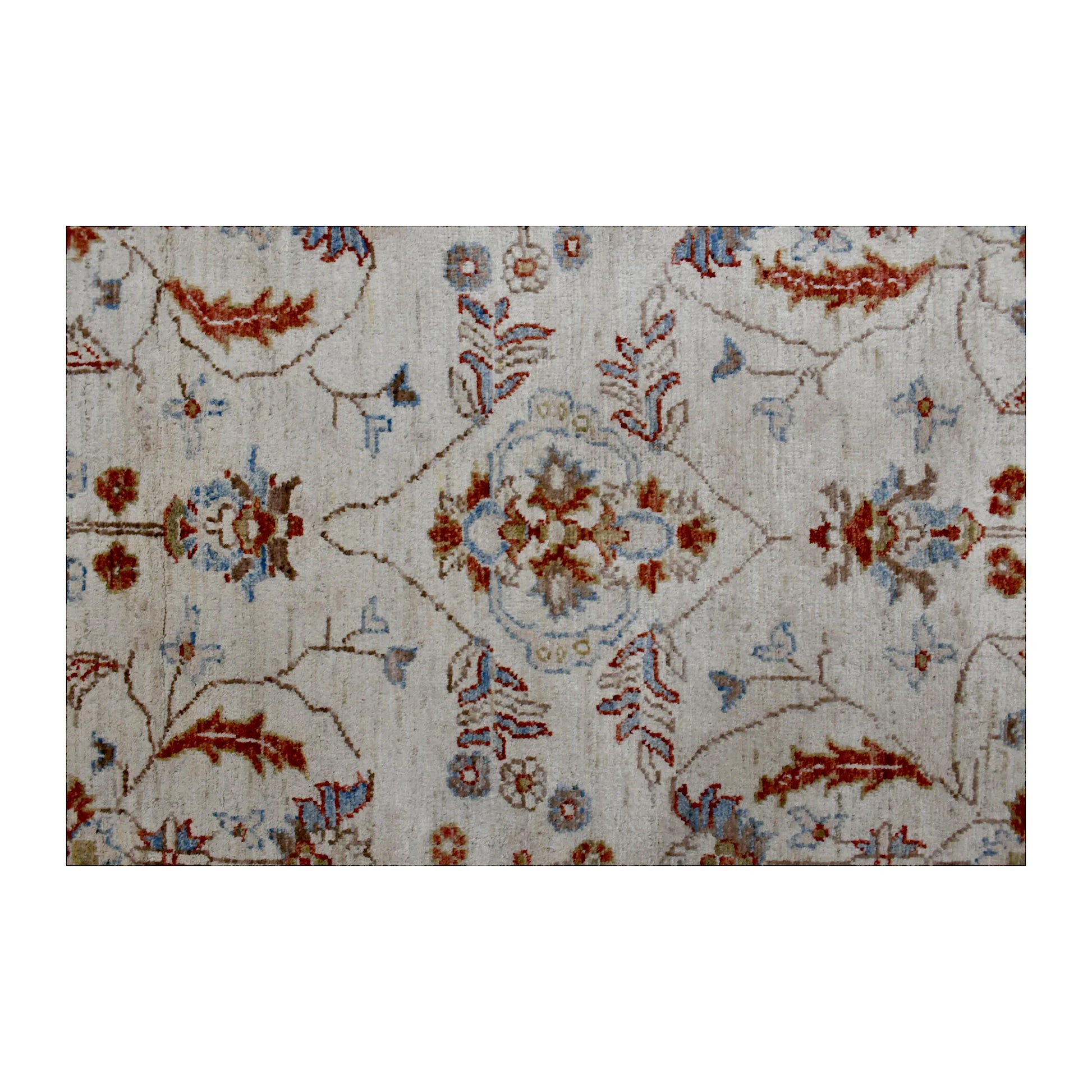Close-up of beige Chobi rug showing the central floral motif, scrolling vines and pale blue accents