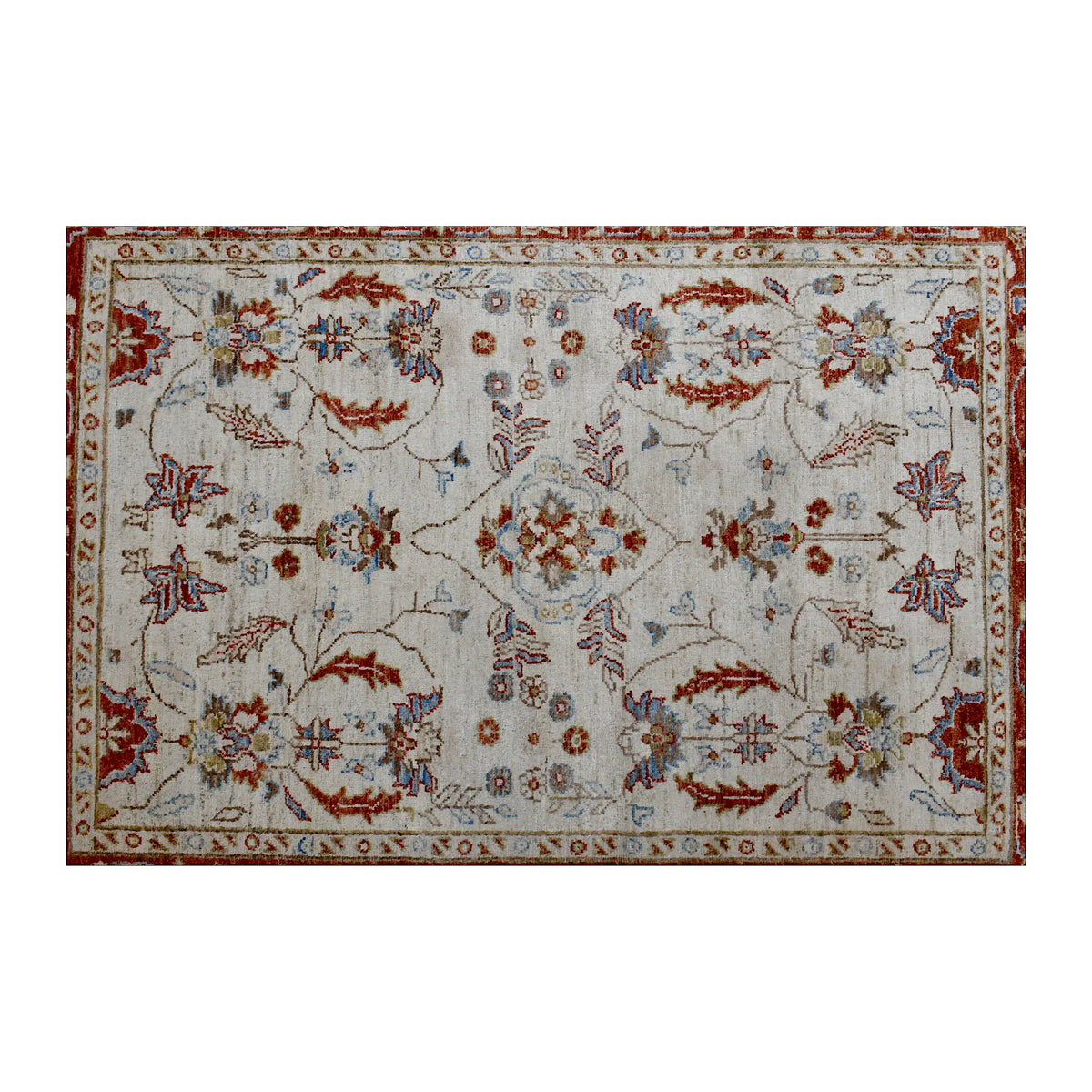 Floral field view of Afghan Chobi rug showing its symmetrical vine pattern, warm border and pale blue details