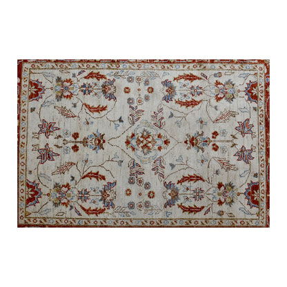 Floral field view of Afghan Chobi rug showing its symmetrical vine pattern, warm border and pale blue details