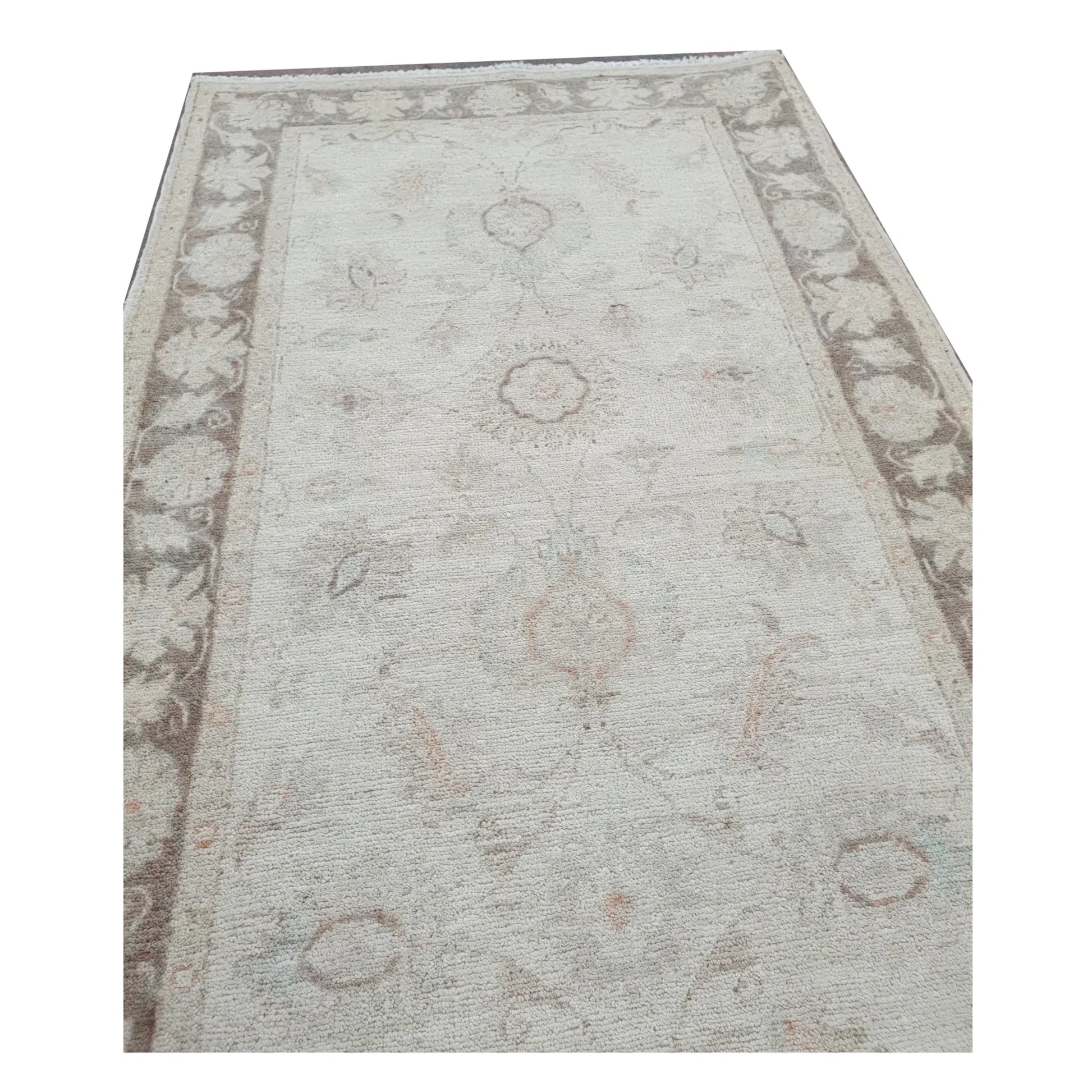 End detail of Afghan Chobi beige floral runner showing border and floral pattern