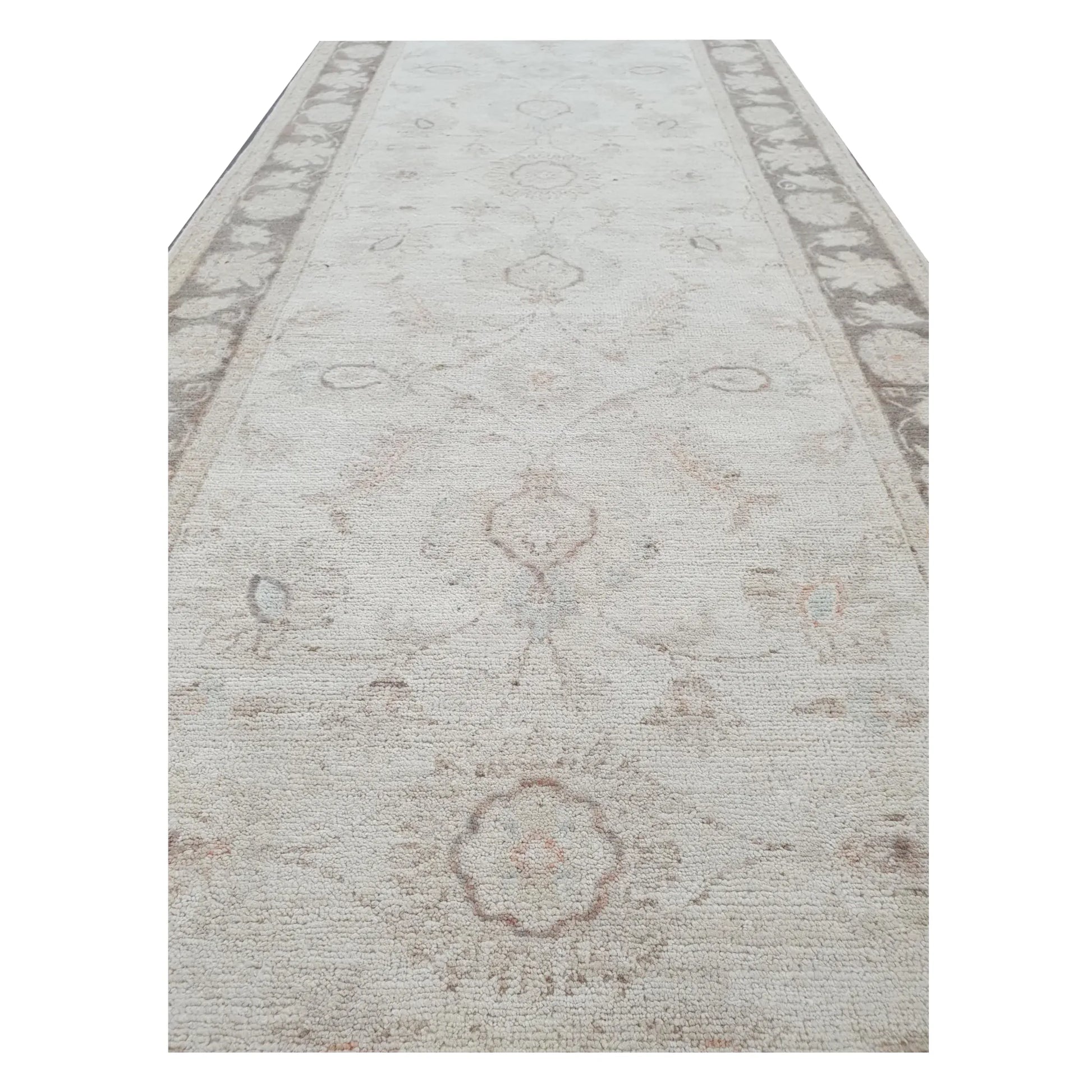 Field detail of Afghan Chobi beige floral runner showing soft wool pile and motifs
