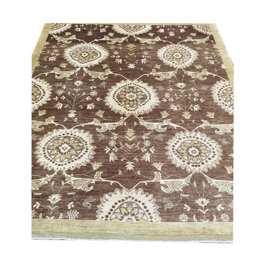 Border detail of Afghan Chobi brown floral rug showing beige wool pattern and fringe