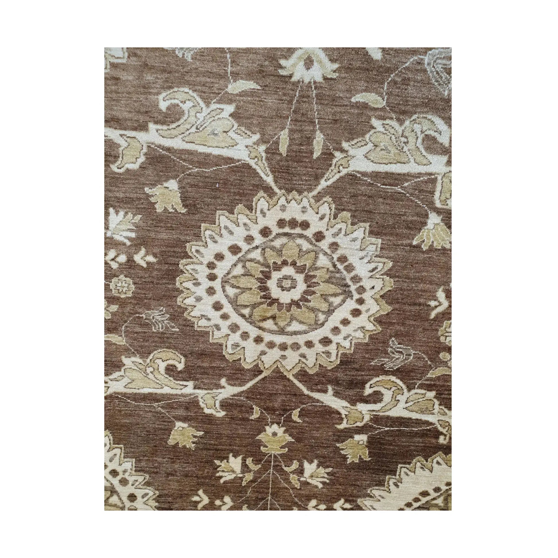 Field detail of Afghan Chobi brown floral rug showing beige floral motifs