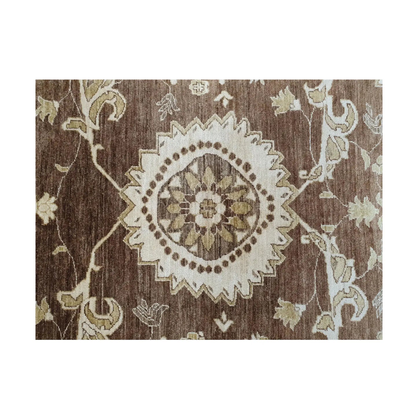 Floral detail of Afghan Chobi brown rug showing beige and ivory wool motifs