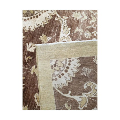 Folded edge detail of Afghan Chobi brown floral rug showing backing and border texture