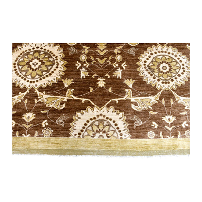 Fringe-end detail of Afghan Chobi rug showing ivory medallions, fine floral vines, muted-gold border and white fringe
