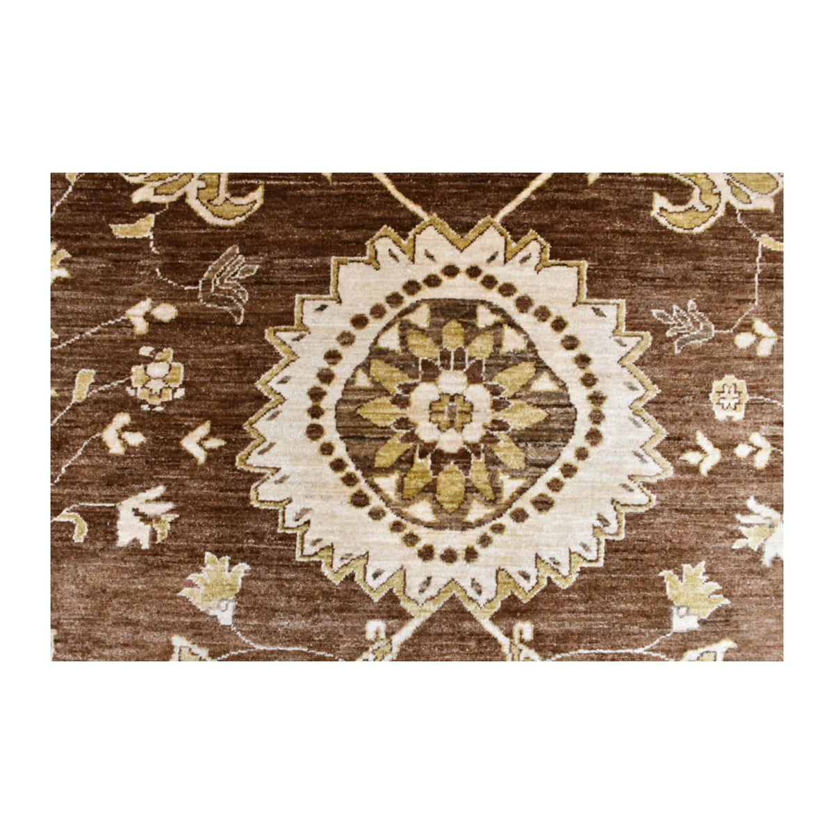 Close-up of a scalloped ivory floral medallion with olive, ochre and brown details on the Chobi rug’s variegated field