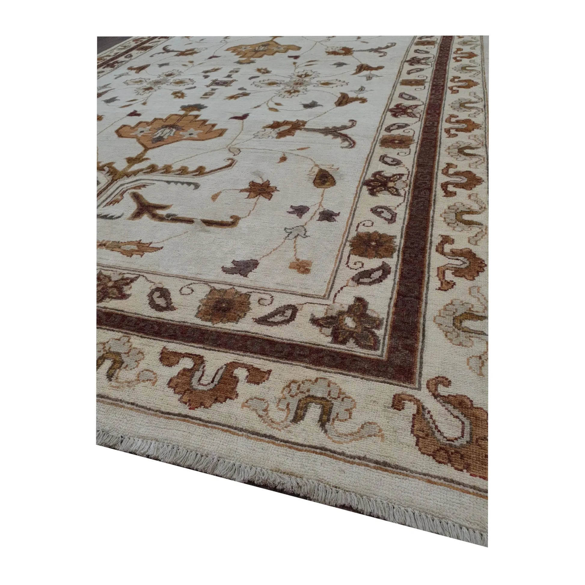Border corner detail of Afghan Chobi brown vine rug showing wool pile and floral pattern