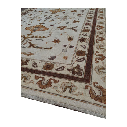 Border corner detail of Afghan Chobi brown vine rug showing wool pile and floral pattern