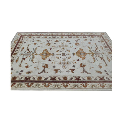 End border detail of Afghan Chobi brown vine rug with beige and brown tones