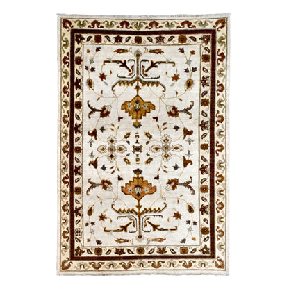 Full view of Afghan Chobi hand-knotted wool rug with ivory field, mirrored brown vines and ochre palmettes, 272 x 179 cm