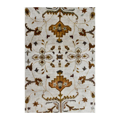 Field detail of Afghan Chobi rug showing mirrored ochre palmettes, brown vines and small flowers on ivory