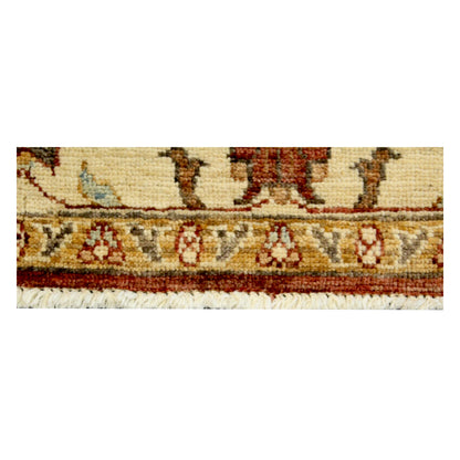 Fringed edge detail showing the narrow floral border and hand-knotted wool pile of the Afghan Chobi rug