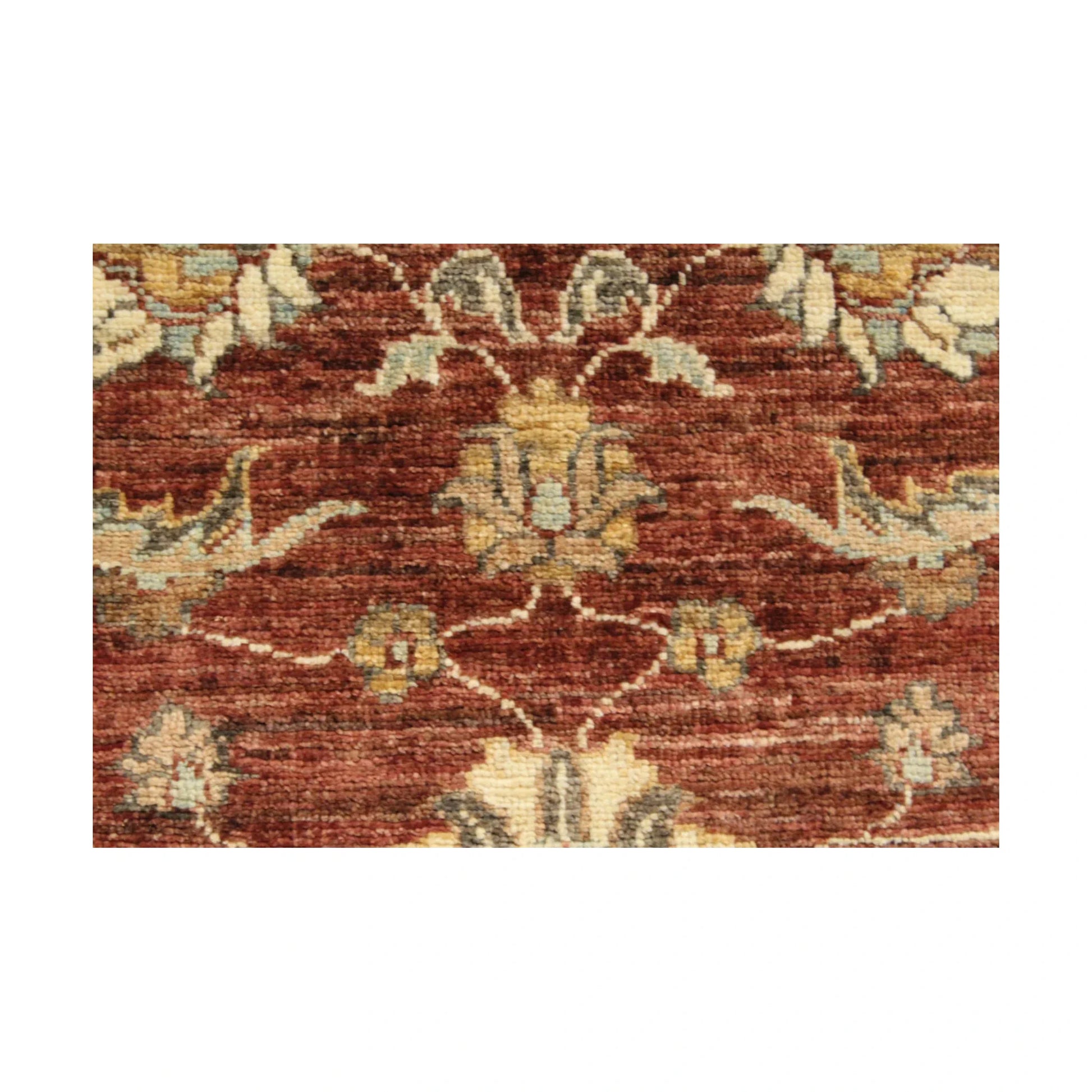 Close-up of rust-red wool pile with golden tan, ivory and muted blue-grey floral motifs