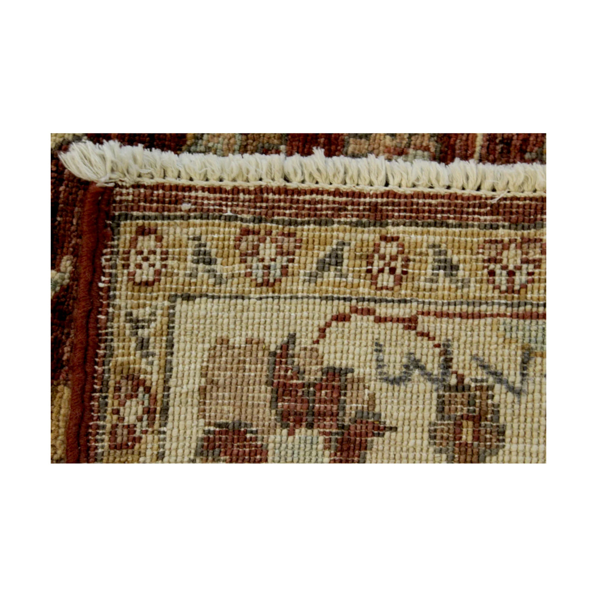Folded corner showing rust-red floral pile, broad ivory border and reverse weave of the Afghan Chobi rug
