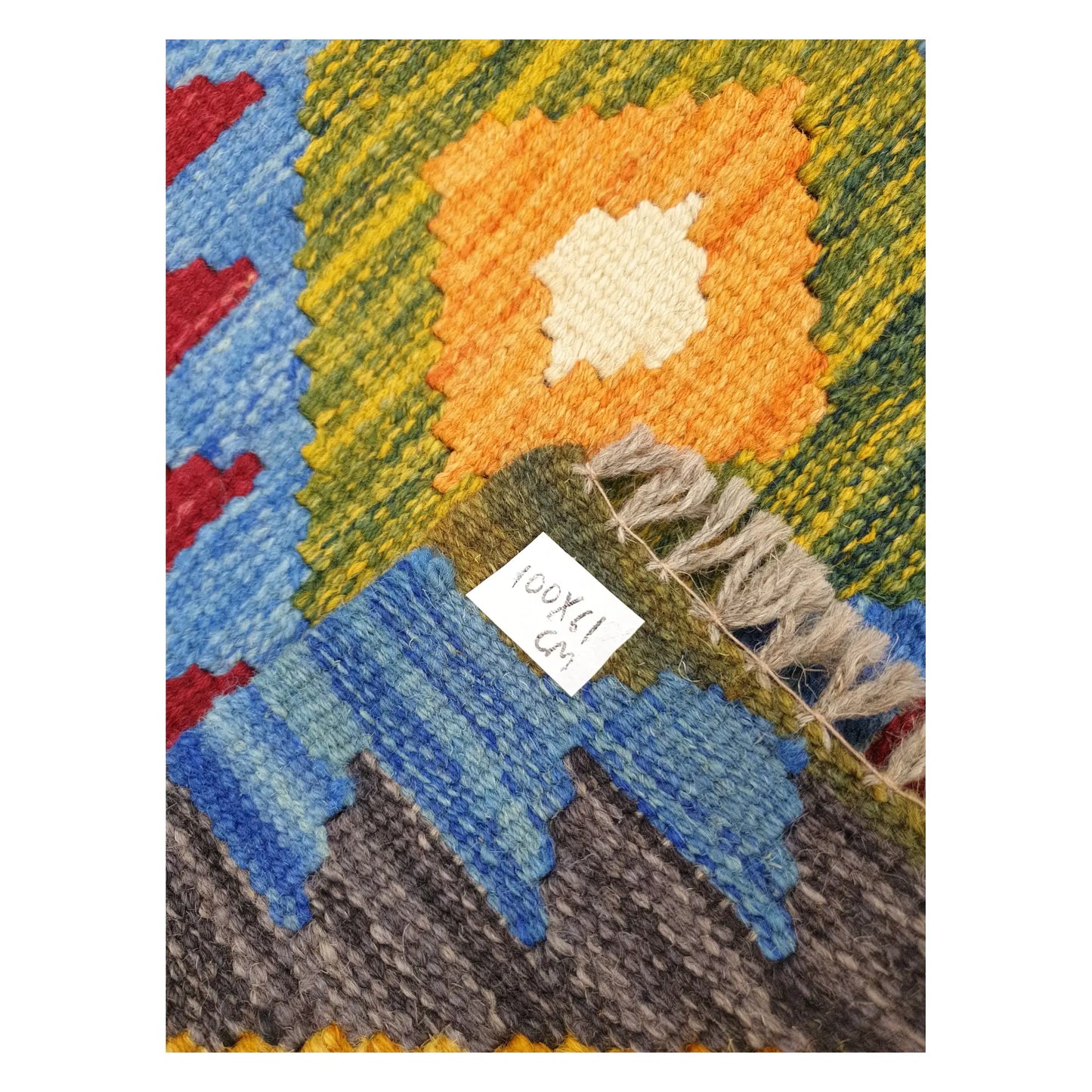 Close-up of Afghan Chobi Kilim wool flatweave texture, fringe, and geometric colour detail, 100 x 61 cm