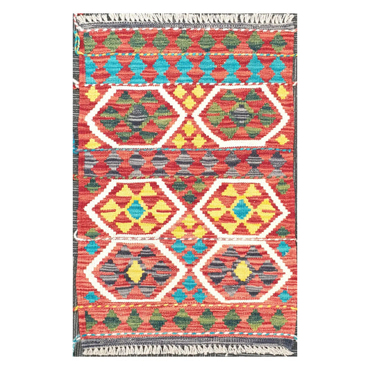 Front view of Afghan Chobi Kilim hand-woven wool rug with coral hexagon medallion design, 75 x 53 cm