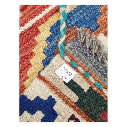 Close-up of Afghan Chobi Kilim wool flatweave texture, fringe, and geometric colour detail, 85 x 60 cm
