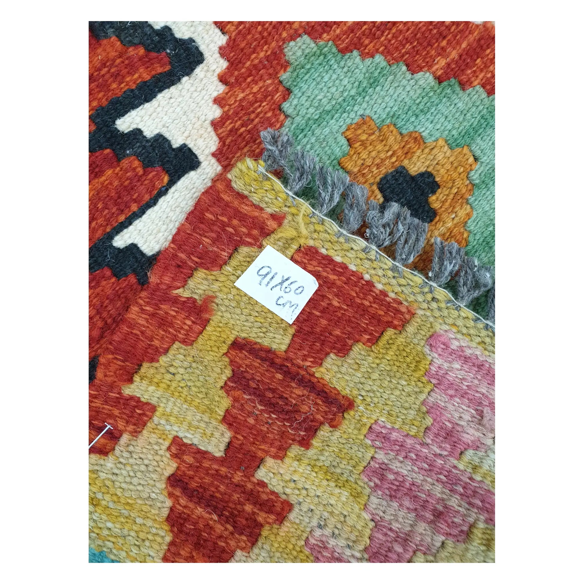 Close-up of Afghan Chobi Kilim wool flatweave texture, fringe, and geometric colour detail, 91 x 60 cm