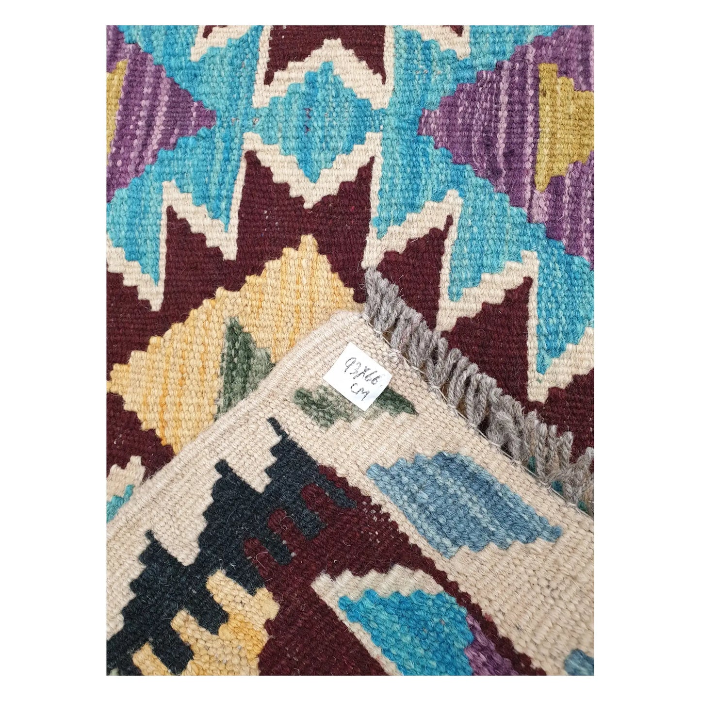 Close-up of Afghan Chobi Kilim wool flatweave texture, fringe, and geometric colour detail, 93 x 66 cm                 
