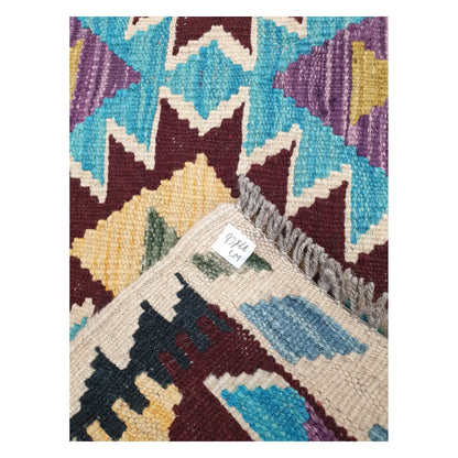 Close-up of Afghan Chobi Kilim wool flatweave texture, fringe, and geometric colour detail, 93 x 66 cm                 