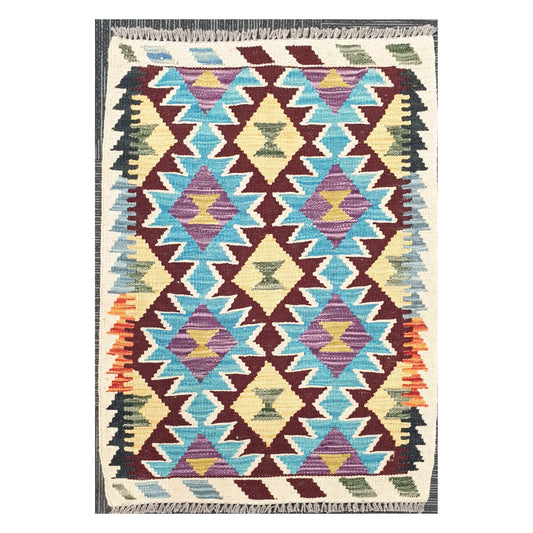 Front view of Afghan Chobi Kilim handwoven wool rug with turquoise diamond lattice design, 93 x 66 cm
