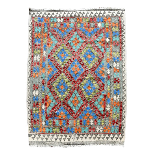 Full view of Afghan Chobi Kilim rug with repeating blue and turquoise diamond medallions, a rust-red lattice and ivory border, 196 x 155 cm.