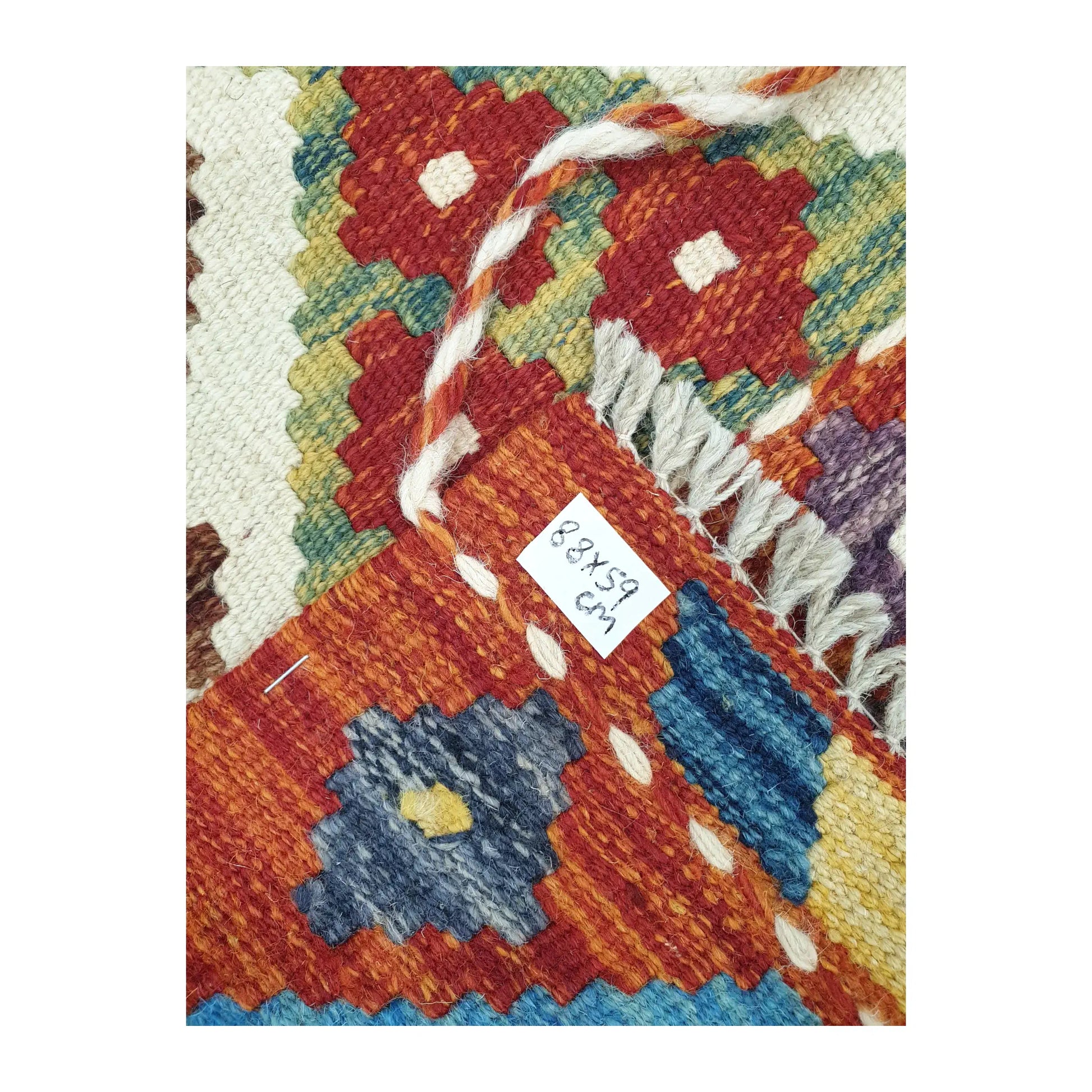 Corner detail of Afghan Chobi Kilim hand-woven wool rug showing flatweave texture and fringe