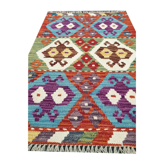 Pattern detail of Afghan Chobi Kilim hand-woven wool rug with colourful geometric diamonds