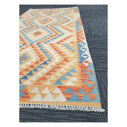 Angled detail of Afghan Chobi Kilim showing fringe, geometric border, and handwoven flatweave pattern, 188 x 103 cm