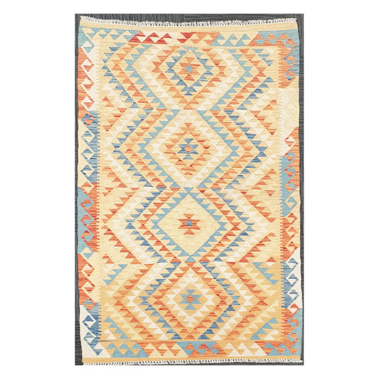 Full view of Afghan Chobi Kilim flatweave wool rug with chevron diamond field on an ivory ground, 188 x 103 cm