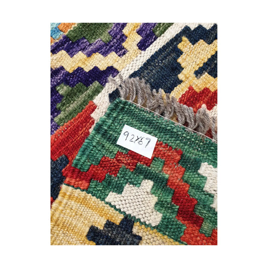 Fringe detail of Afghan Chobi Kilim hand-woven wool rug showing woven texture and product tag