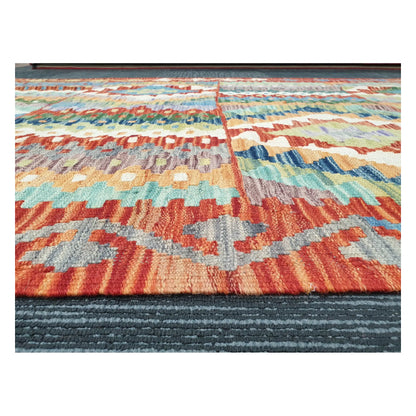 Low-angle close-up of Afghan Chobi Kilim showing hand-woven wool texture and striped geometric pattern, 180 x 122 cm