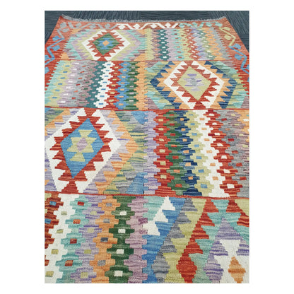Close-up of Afghan Chobi Kilim rug with pastel diamond motifs in blue, sage, mint, ivory, and terracotta, 180 x 122 cm
