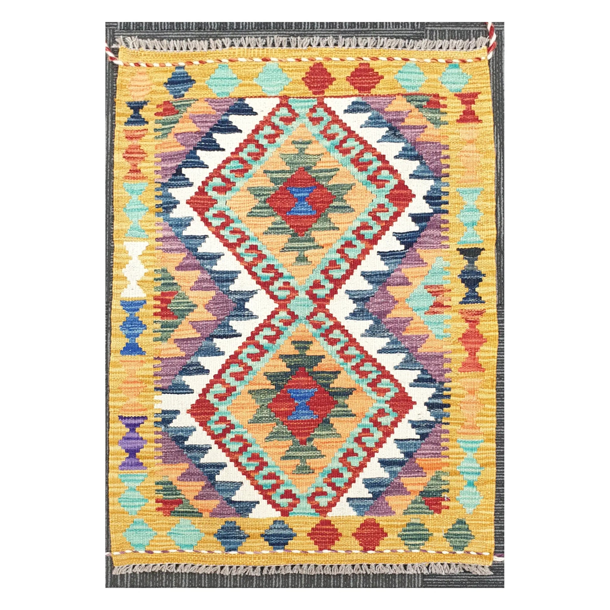 Front view of Afghan Chobi Kilim handwoven wool rug with colourful geometric pattern, 92 x 60 cm