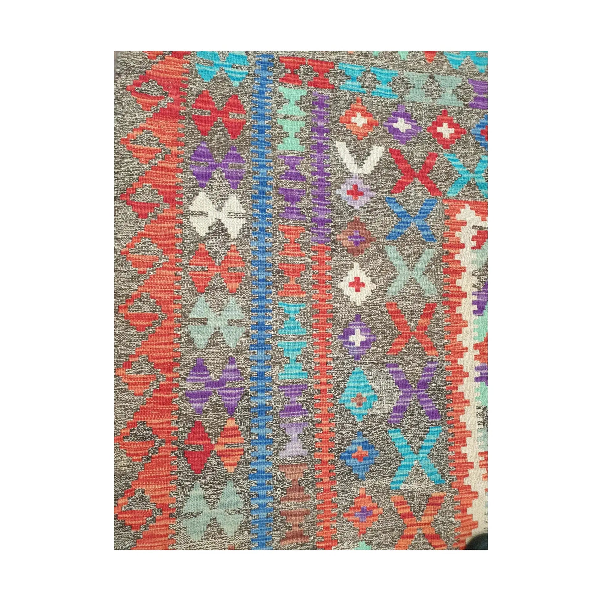 Side border detail of Afghan Chobi Kilim rug showing colourful flatweave pattern