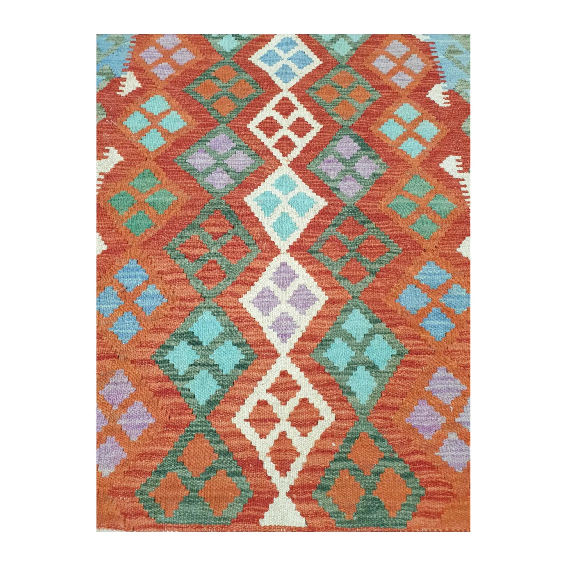 Pattern detail of Afghan Chobi Kilim hand-woven wool rug showing orange, green and ivory motifs