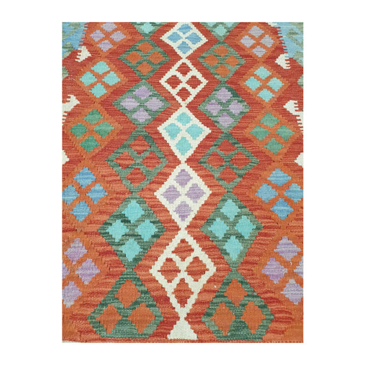 Pattern detail of Afghan Chobi Kilim hand-woven wool rug showing orange, green and ivory motifs