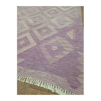 Border detail of Afghan Chobi Kilim purple diamond rug showing fringe and woven motifs