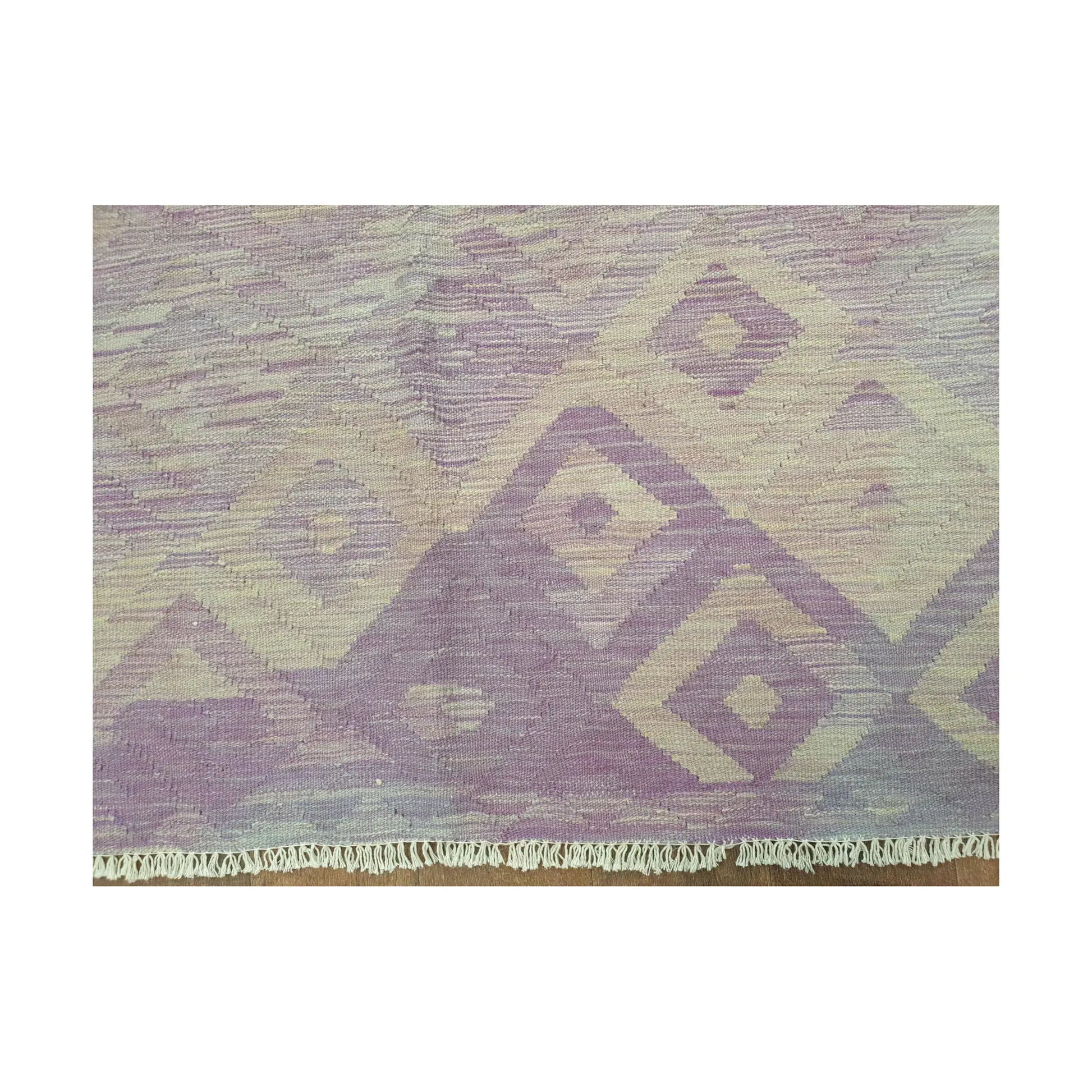 Pattern detail of Afghan Chobi Kilim purple diamond rug showing muted geometric motifs