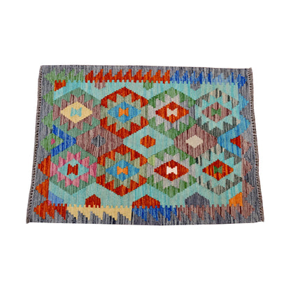 Complete pattern view of Afghan Chobi Kilim rug with aqua, orange, blue, green and ivory geometric design