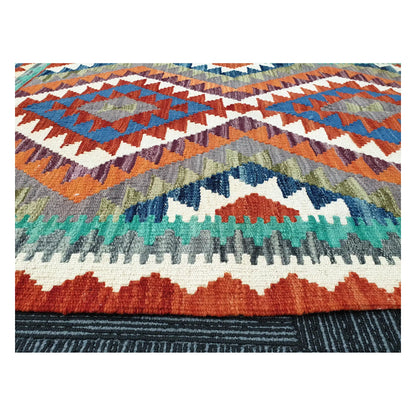 Low-angle close-up of Afghan Chobi Kilim showing wool flatweave texture and geometric tribal pattern, 119 x 84 cm